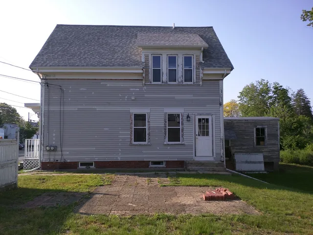 Two-story gray home with fresh siding
