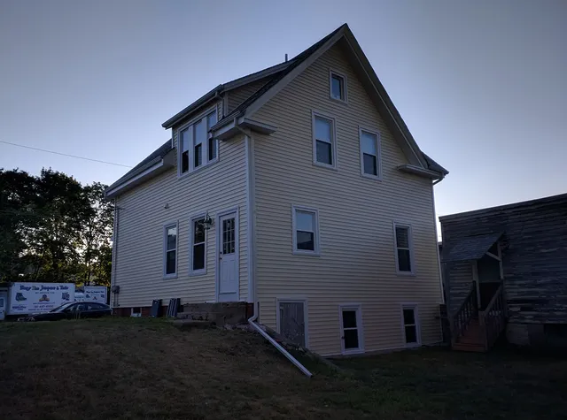 Two-story home with new beige siding and trim