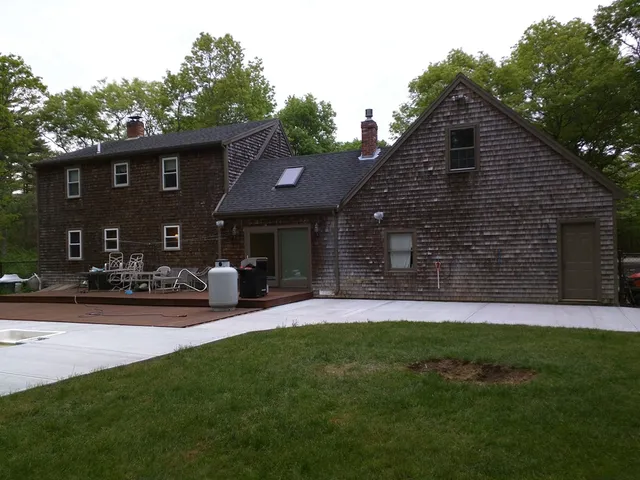 Weathered brown shingle-sided homes before a new exterior