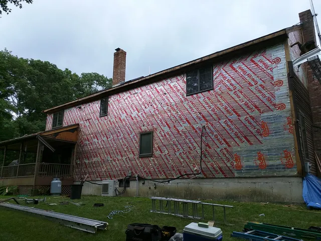 Large home wrapped in house wrap ahead of new siding