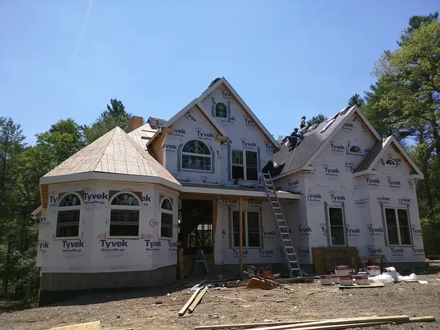 Multi-gabled home wrapped and ready for new siding