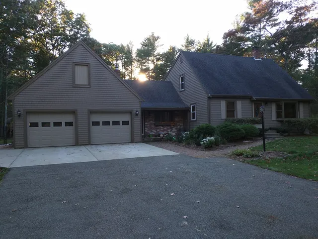 Gray home and garage with new siding