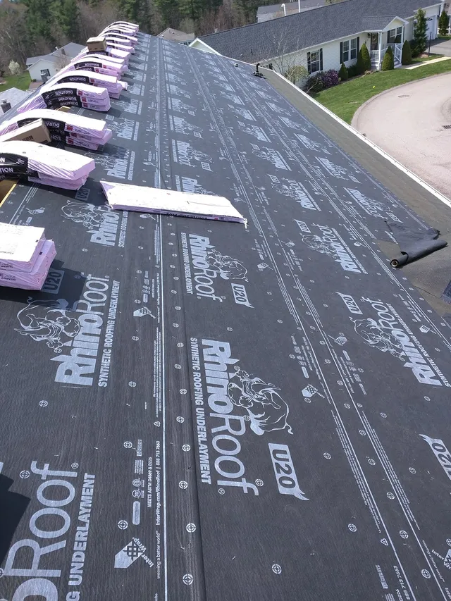Roof underlayment rolled out over a new deck